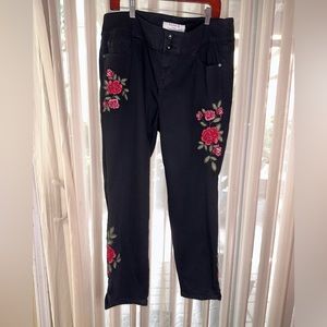 -Torrid skinny black jeans with rose detail